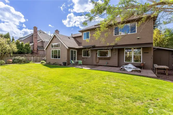 Mature parking ideal for quiet conversation & outdoor fun plus entertainment.  Attached garden shed at far right.  The home has retractable sunshades along the rear of the home, front he sliding glass door across to the dining room at far right.