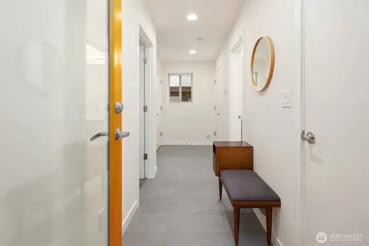 Entry level with access to den, bathroom, storage and garage.