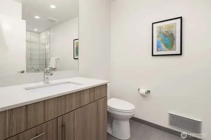 First floor bathroom convenient for the home office/ den/ guest space.