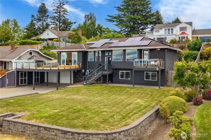 Notice the expansive front yard, with decks overlooking the yard whie you take in the amazing view.