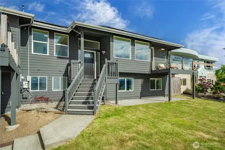 Covered Entry and covered patio space under the deck, perfect area for a patio furniture set!
