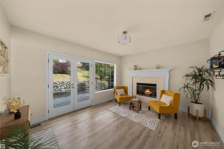 Next to the Primary suite is a beautiful sitting area. The french doors lead to the beautiful backyard and hot tub.