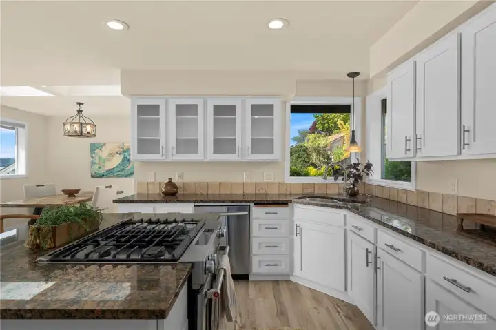 Stainless steel gas stove  anchors the kitchen, perfect for gathering and entertaining.