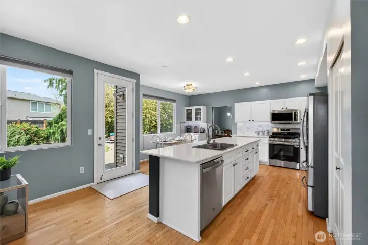 Hardwood floors, large island, SS appliances, soft close and amble natural light