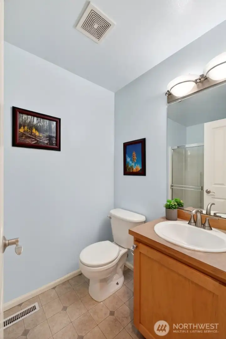 Bathroom with a shower on the main floor perfect for guests or multigenerational living