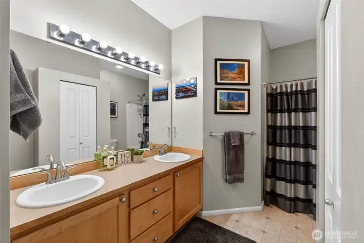 Full bathroom with storage closet on upper floor
