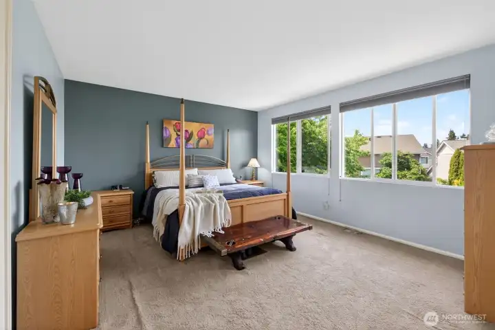Welcome to your large Primary suite which includes space for your king-sized bed plus dressers & nightstands