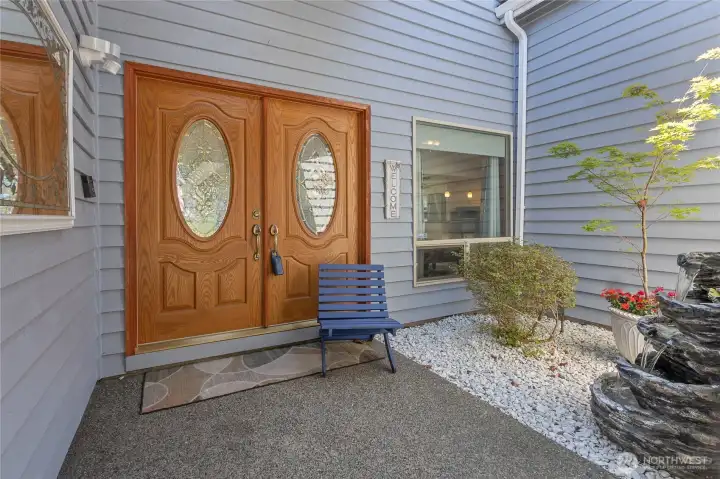 Entry is inviting and offers a peaceful courtyard for decorating or creating a sitting area.