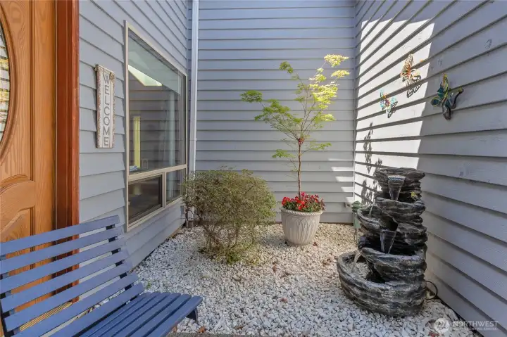 Serene courtyard area with water feature.