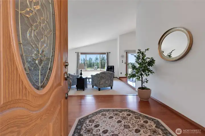 Entry is inviting and open to living room and amazing view.