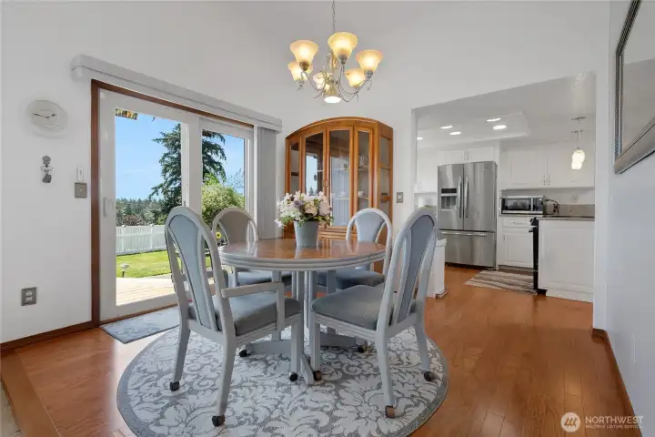 Formal dining area with slider to back deck.