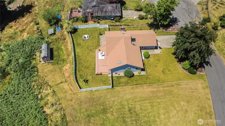 This home is in amazing condition and offers so much space to enjoy.  Property extends past the white vinyl fence to the storage shed on the left side in this photo