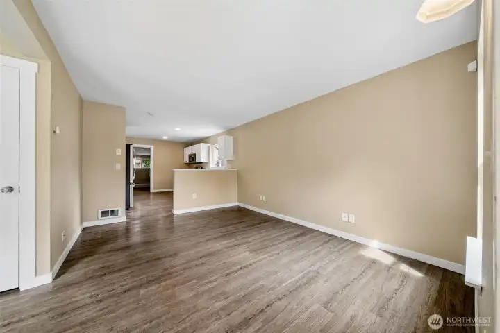 Welcome home to the open layout from living room to kitchen, freshly painted.