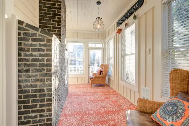 The fully enclosed sunroom is a lovely space to read and could also be an office (with an ocean view!).