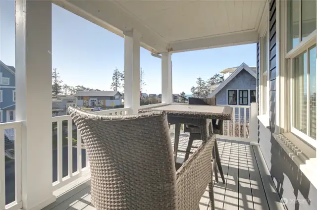 The upper covered porch is a great place to sip your morning coffee or play a game of chess!  Soak up the sunshine and the breeze & ocean views!