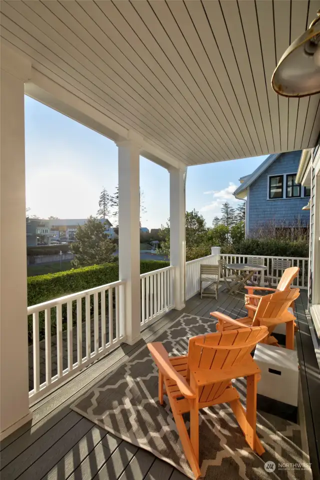 Soak up the sunshine on the covered south facing porch. This porch sits above the sidewalk for extra privacy.  Take in the gorgeous ocean view and do a little 'people watching'.