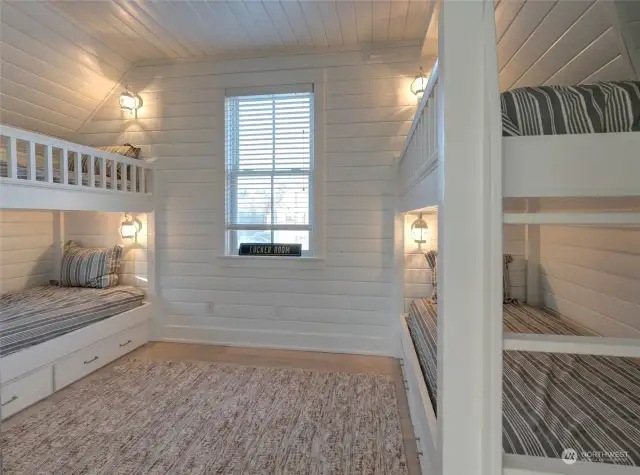 Behind the barn doors are two sets of bunks.