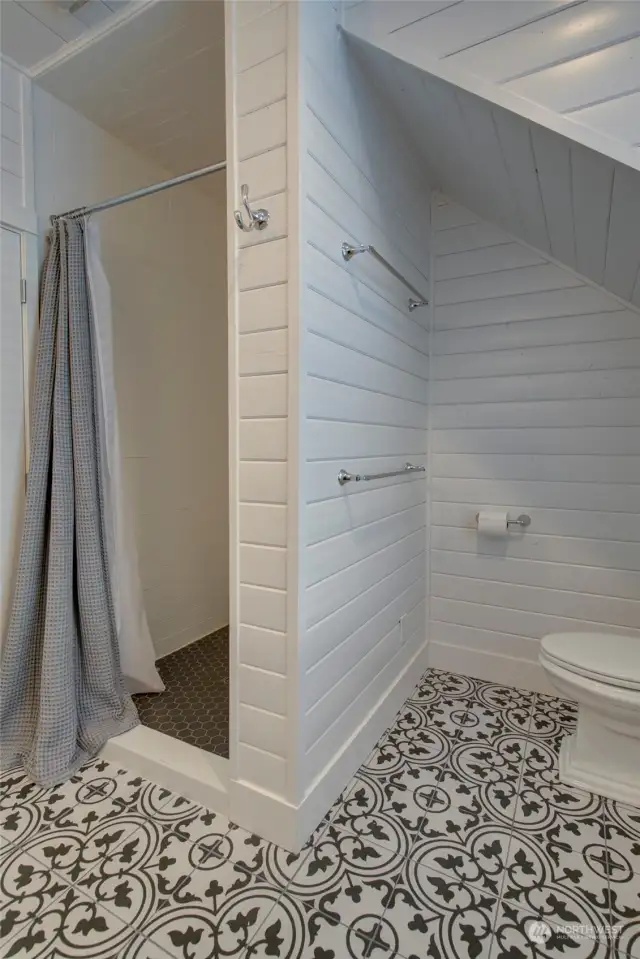 ...with custom tile and tongue and groove siding.