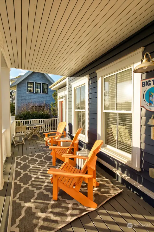 Beyond the covered porch is an open patio with pavers for extra seating.