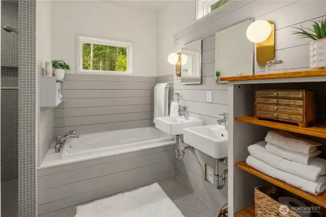 Primary Ensuite with zero-threshold tiled shower & wall mounted sinks