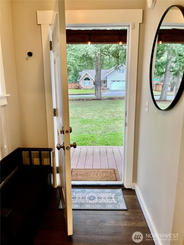 Welcome to your new home, featuring a cozy covered porch and inviting entry area