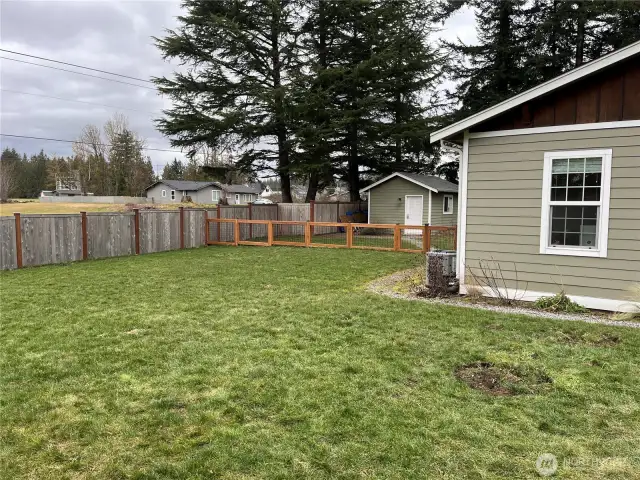 Large, fenced lot with a blank slate, offering endless possibilities for outdoor activities, gardening, or creating your own private retreat.