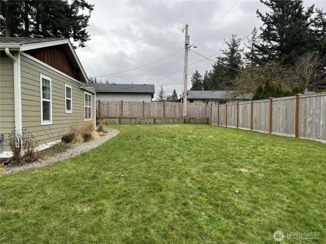 High privacy fence and updated outdoor siding, enhancing both the security and curb appeal of the home while providing a fresh, modern look.