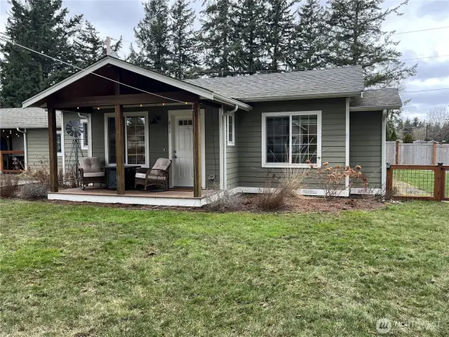 Great curb appeal with a charming covered front porch, adding to the inviting and welcoming feel of the home.