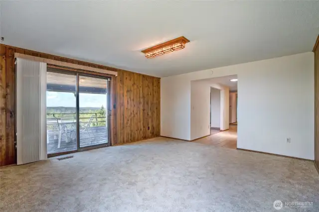 Another view of the room to the left of the entry way and deck access.