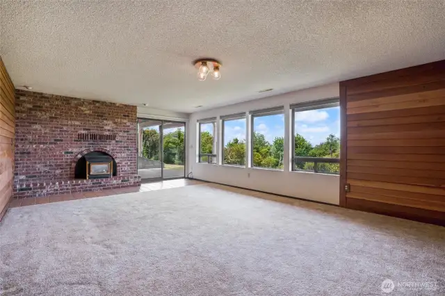 A huge bonus room with fireplace is a great hang-out space.