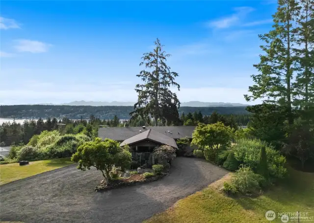 Welcome home to 12808 Canterwood Blvd. in Gig Harbor, WA. A circular driveway makes for easy access and exiting from the property.