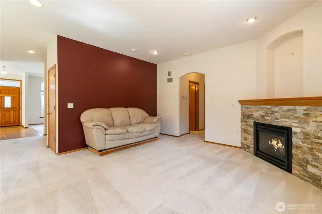 Open concept living room area with gas fireplace!