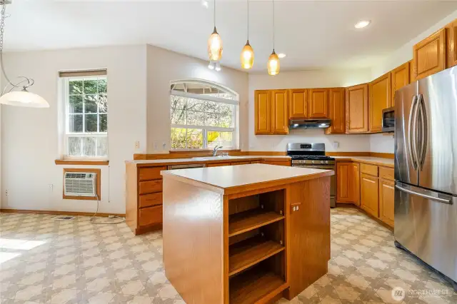 Lots of kitchen cabinets and natural light