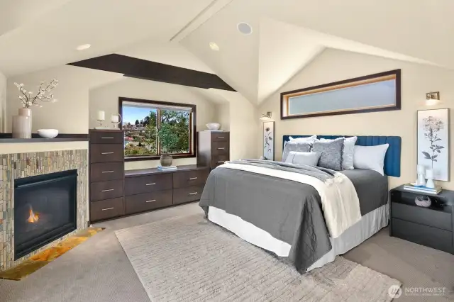 Built-in storage and fireplace make for a cozy experience every night in the primary suite