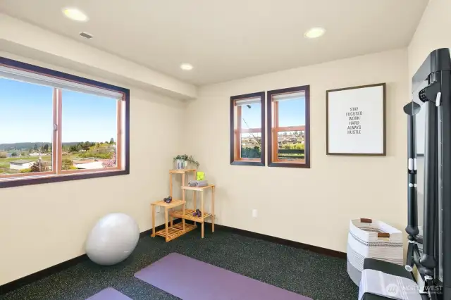 Lower floor gym/studio has cork floors and a tonal workout machine built in to the wall
