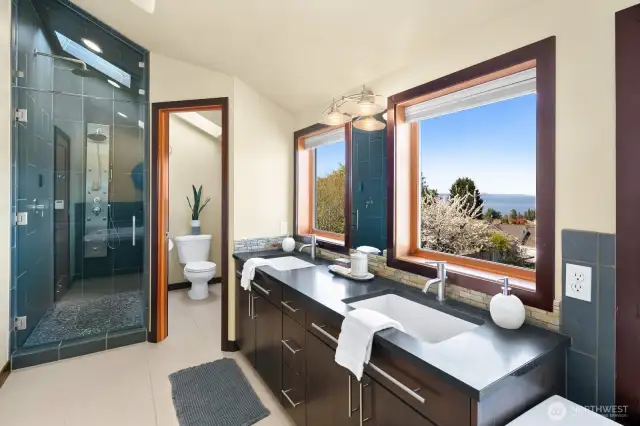 Primary bath has a large soaking tub and 8 sprayer shower with rain shower head