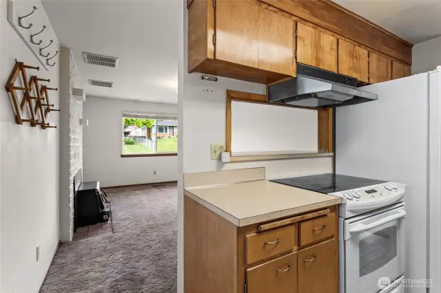 Kitchen w/ pass through window to family room