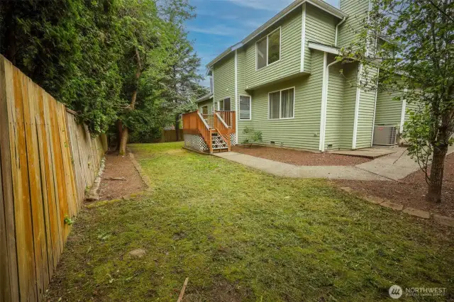 Fully fenced backyard and mature trees for privacy