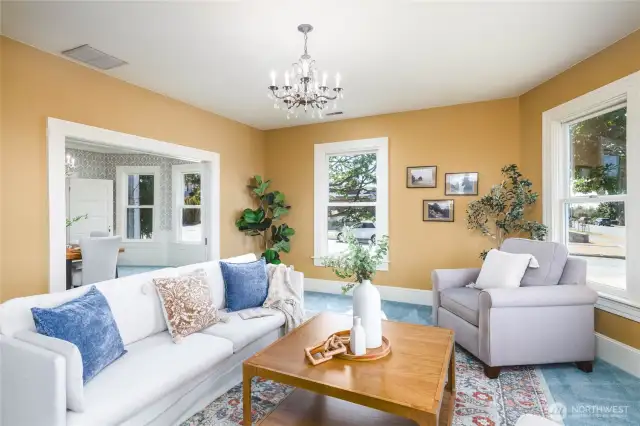 Spacious formal living room opens to the formal dining room through gorgeous French pocket doors. Bathed in light, you can bring in the ambiance of Old Town charm.