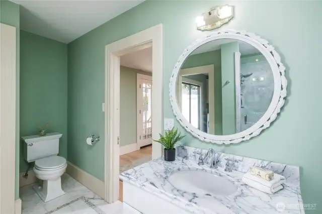 Downstairs 3/4 bath with marble vanity and shower (not shown).