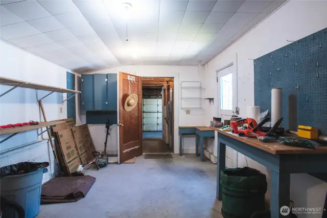 Such a great hobby room/shop area!! Beyond the door is the storage room and beyond that is the garage.