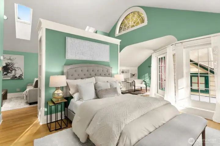 The primary suite really is a suite!  It feels like a private sanctuary: vaulted ceilings, elegant trim work, skylights and French doors opening to the treetops.