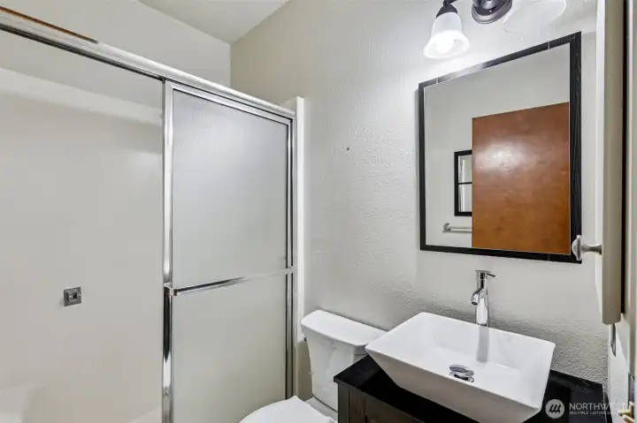 Bathroom next to the family room. Updated vanity.