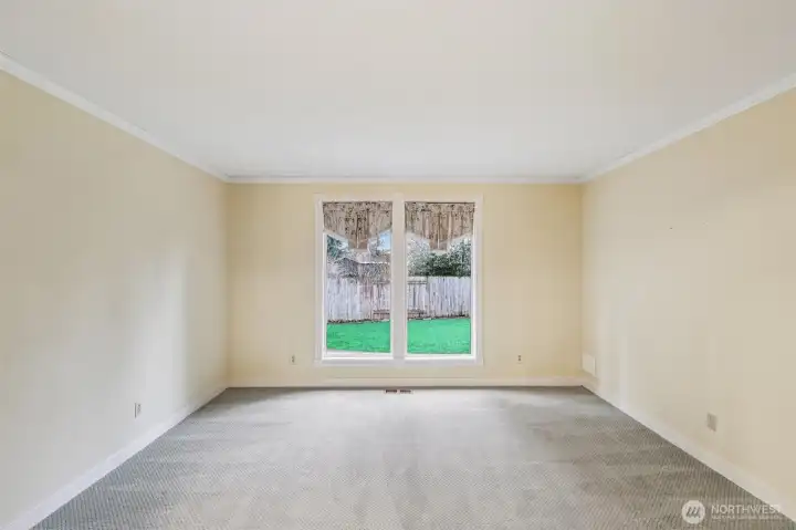Living room with view of the backyard. Beautiful light!