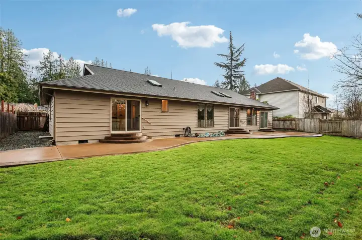 Backyard with gravel space.