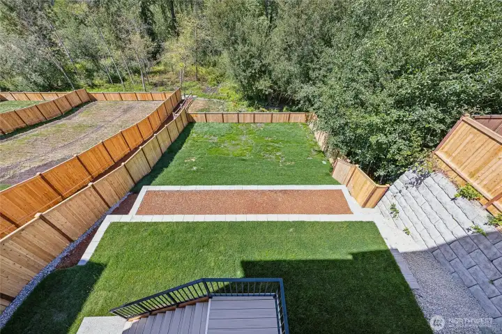 Large yard offers spaces for play, garden, and pets. Not to mention it backs to NGPA for quiet, private, peaceful views.