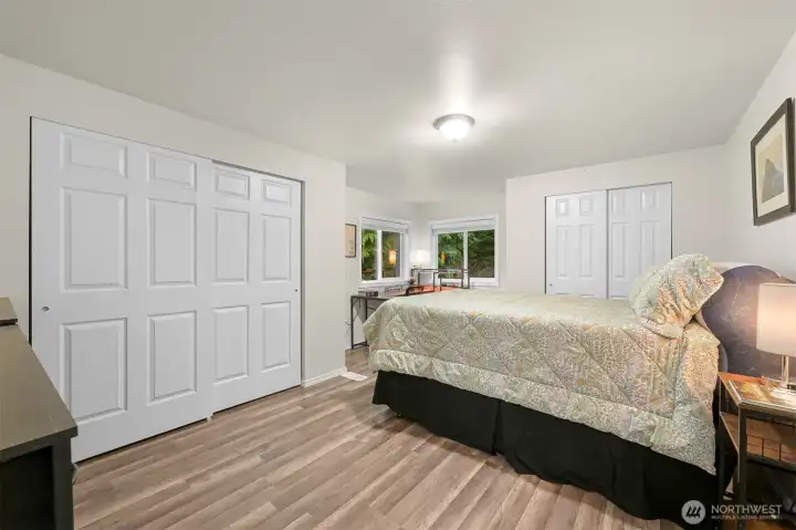 Very large bedroom has two closets.