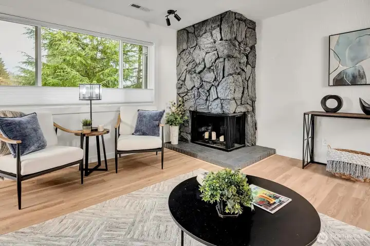 Fireplace is wood burning, however, with an electrical outlet near the hearth you could easily add an electric fireplace insert.
