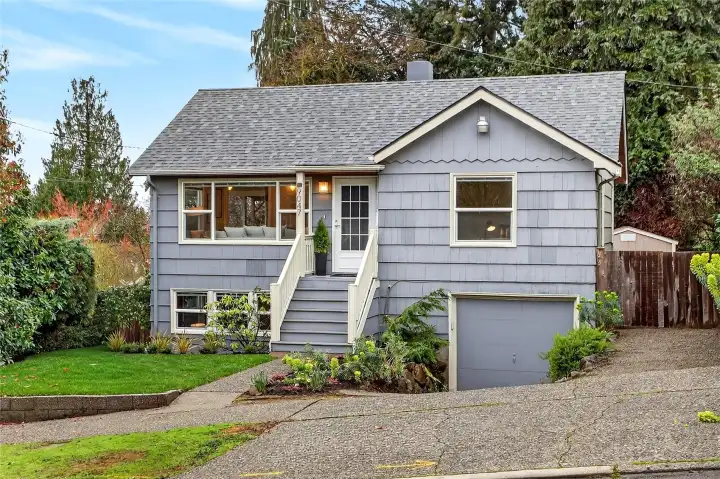 Cozy bungalow surrounded by mature landscaping for privacy.
