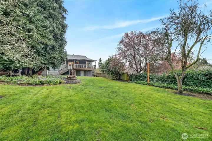 Spacious backyard is a great space for the gardener at heart and lawn games when entertaining guests.